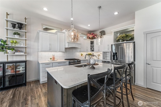 1080 Sunset Ln, Chelan, WA 98816 - kitchen with premium appliances, open shelves, a sink, backsplash, and recessed lighting