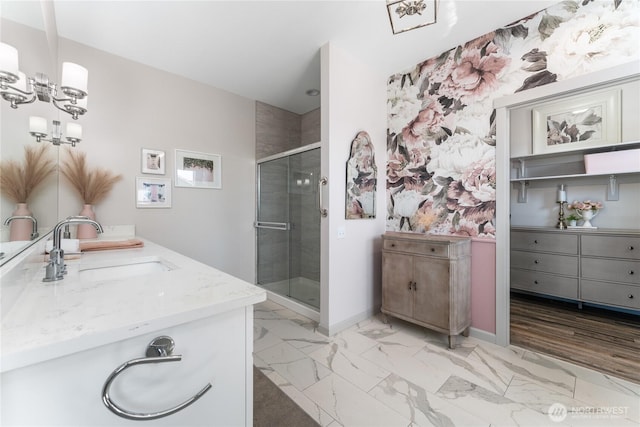 1080 Sunset Ln, Chelan, WA 98816 - bathroom featuring a stall shower, vanity, marble finish floors, and baseboards