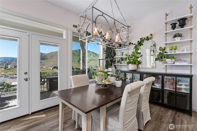 1080 Sunset Ln, Chelan, WA 98816 - dining room featuring wood finished floors, a chandelier, a mountain view, and french doors