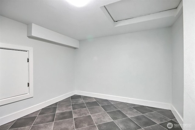 300 Cascade Ave, Granite Falls, WA 98252 - spare room featuring dark tile patterned floors and attic access