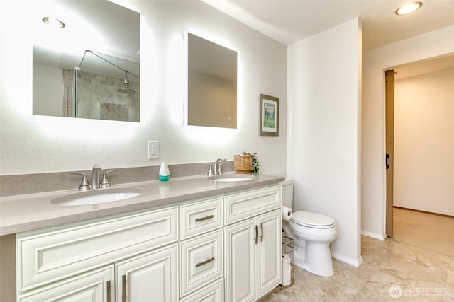 18909 SE 263rd St, Covington, WA 98042 - full bath with double vanity, toilet, a shower, baseboards, and recessed lighting