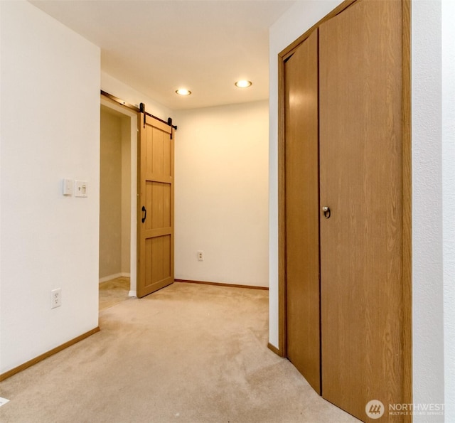 18909 SE 263rd St, Covington, WA 98042 - hall featuring light colored carpet, a barn door, baseboards, and recessed lighting