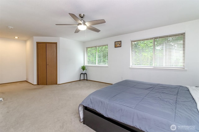 18909 SE 263rd St, Covington, WA 98042 - bedroom with light colored carpet, a ceiling fan, and a closet