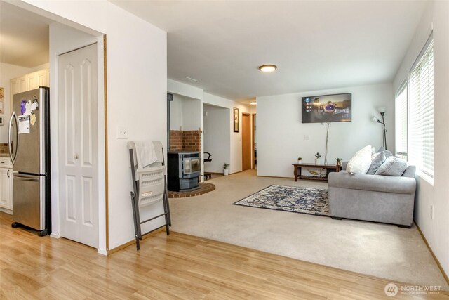 18909 SE 263rd St, Covington, WA 98042 - living room with a wood stove and light wood-type flooring