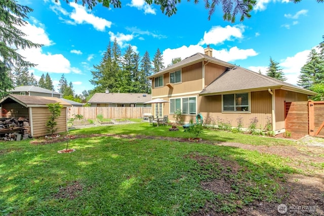 18909 SE 263rd St, Covington, WA 98042 - rear view of house with a chimney and roof with shingles