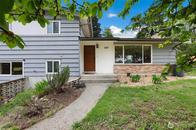 1642 Browns Point Blvd, Tacoma, WA 98422 - doorway to property featuring a yard and brick siding
