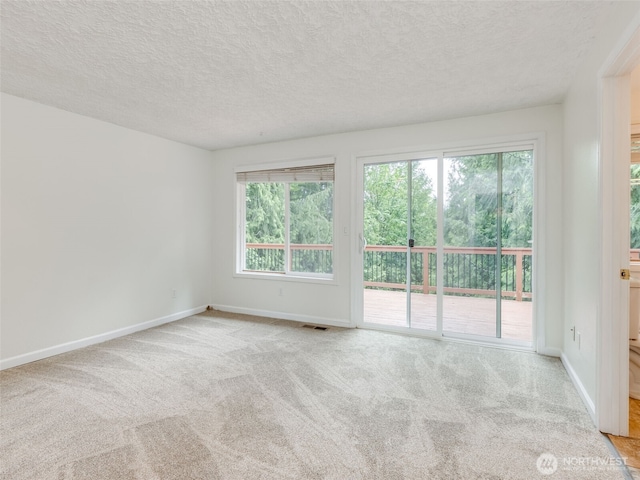 22414 NE 200th St, Brush Prairie, WA 98606 - carpeted empty room featuring a textured ceiling and baseboards