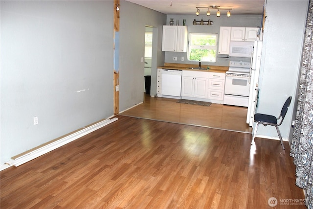 18343 Albany St SW, Rochester, WA 98579 - kitchen featuring white appliances, a sink, white cabinetry, and wood finished floors