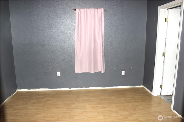 18343 Albany St SW, Rochester, WA 98579 - spare room featuring wood finished floors and baseboards