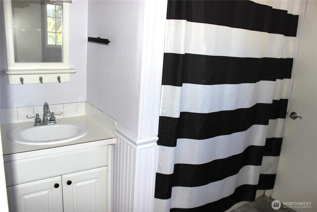 18343 Albany St SW, Rochester, WA 98579 - bathroom with vanity, a textured wall, and curtained shower