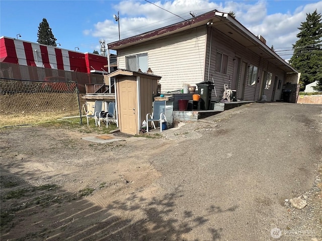 8040 Pacific Ave, Tacoma, WA 98408 - view of property exterior with a storage shed