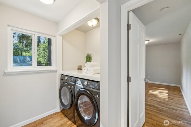 7309 134th Ave NE, Redmond, WA 98052 - laundry room featuring washing machine and dryer, light wood-style floors, and baseboards