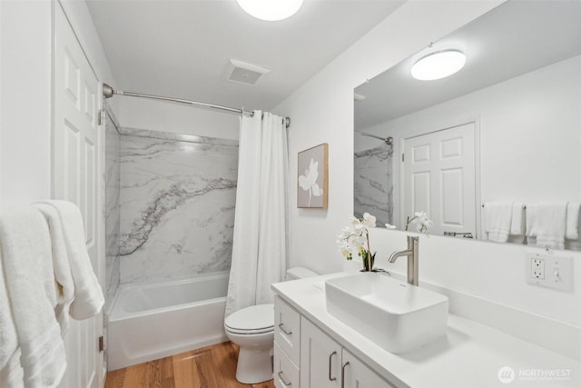 7309 134th Ave NE, Redmond, WA 98052 - full bath with vanity, shower / tub combo with curtain, toilet, and wood finished floors