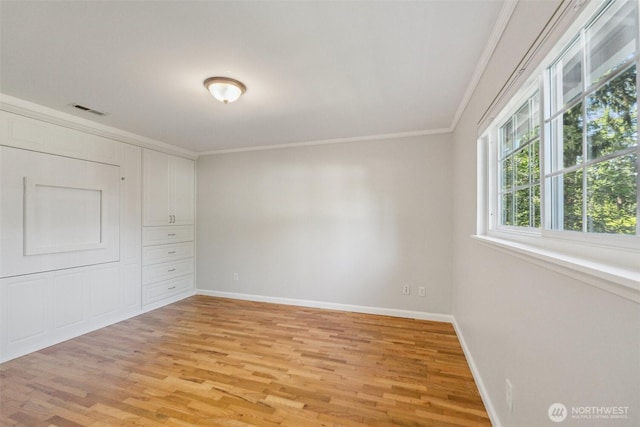 7309 134th Ave NE, Redmond, WA 98052 - spare room featuring ornamental molding, light wood-type flooring, and baseboards