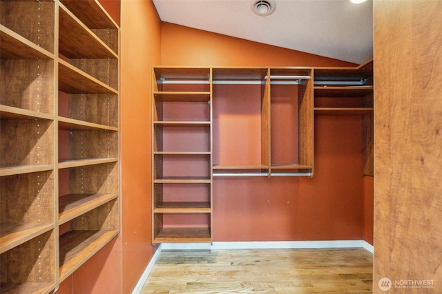 7309 134th Ave NE, Redmond, WA 98052 - walk in closet with vaulted ceiling and wood finished floors