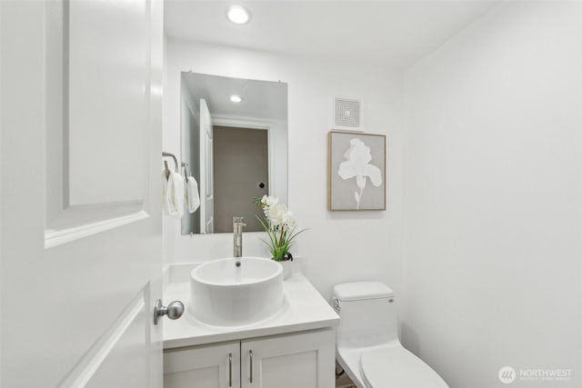 7309 134th Ave NE, Redmond, WA 98052 - half bathroom with vanity, toilet, and recessed lighting