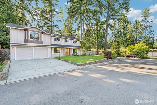 7309 134th Ave NE, Redmond, WA 98052 - view of front of home featuring concrete driveway, an attached garage, and board and batten siding