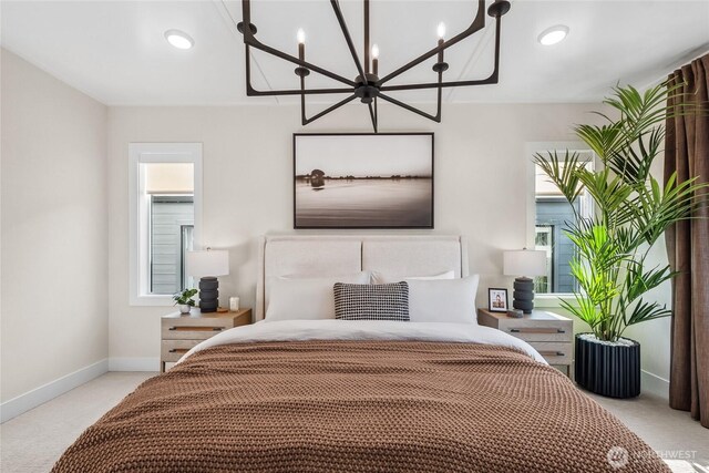 15310 204th Ave E Unit 22, Bonney Lake, WA 98391 - bedroom featuring a chandelier, light carpet, and baseboards