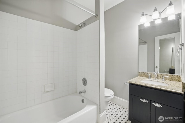 2132 5th Ave Unit 209, Seattle, WA 98121 - full bathroom featuring toilet, vanity, washtub / shower combination, and baseboards
