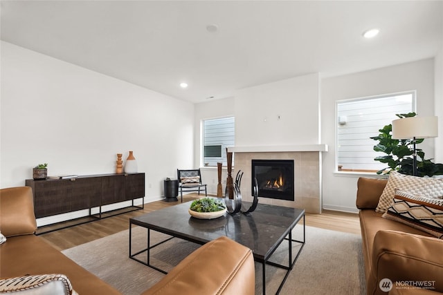 20402 154th St E Unit 4, Bonney Lake, WA 98391 - living room with a fireplace, wood finished floors, recessed lighting, baseboards, and healthy amount of natural light