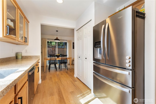 2629 123rd Pl SW Unit A, Everett, WA 98204 - kitchen featuring appliances with stainless steel finishes, light wood-type flooring, glass insert cabinets, brown cabinetry, and recessed lighting