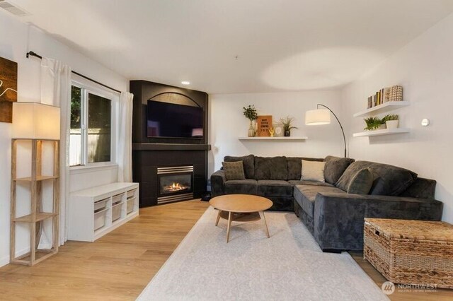 2629 123rd Pl SW Unit A, Everett, WA 98204 - living area with a glass covered fireplace, light wood finished floors, and recessed lighting