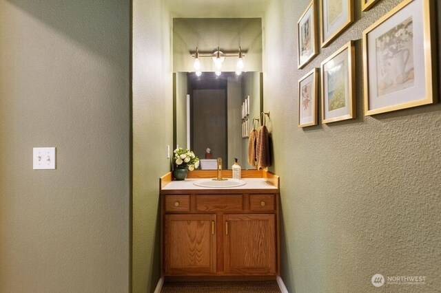 2629 123rd Pl SW Unit A, Everett, WA 98204 - bathroom featuring vanity, a textured wall, and baseboards