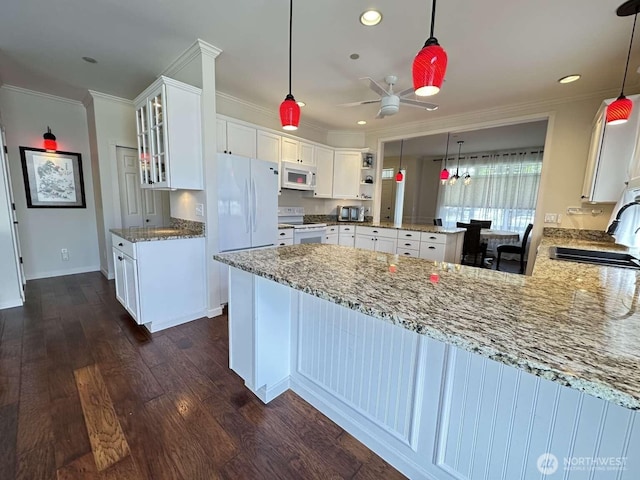 1436 Latham Ct, Dupont, WA 98327 - kitchen featuring white appliances, a peninsula, crown molding, a sink, and light stone countertops