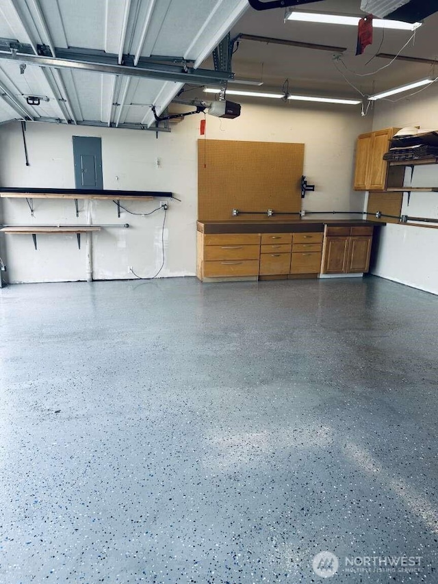 1436 Latham Ct, Dupont, WA 98327 - garage featuring electric panel and a garage door opener