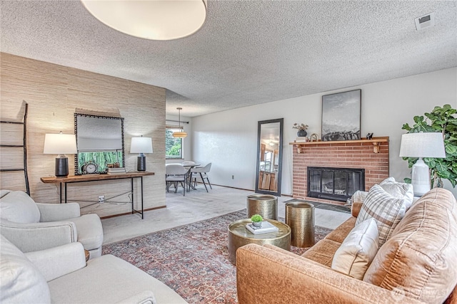 27 Poplar Ave, Wenatchee, WA 98801 - living room featuring a fireplace and a textured ceiling