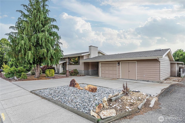 27 Poplar Ave, Wenatchee, WA 98801 - view of front of house featuring an attached garage, driveway, a chimney, and a shingled roof