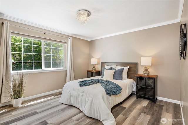 78 Honeycomb Ln, Bellingham, WA 98229 - bedroom with wood finished floors, ornamental molding, and a chandelier