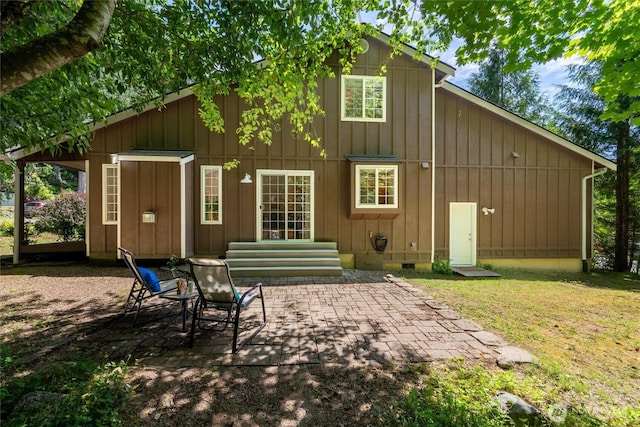 78 Honeycomb Ln, Bellingham, WA 98229 - back of house featuring a patio, crawl space, board and batten siding, and a lawn