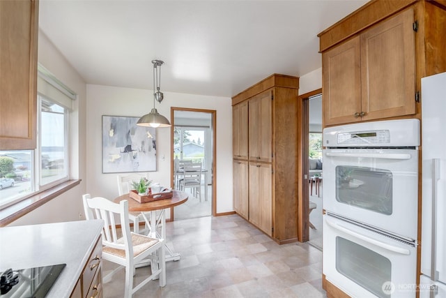 7215 N 23rd, Tacoma, WA 98406 - kitchen featuring white double oven, light flooring, healthy amount of natural light, and black electric cooktop
