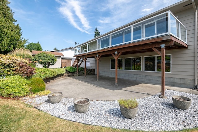 7215 N 23rd, Tacoma, WA 98406 - back of house with stairs, a patio area, and a wooden deck