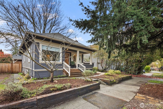 4642 Eastern Ave N, Seattle, WA 98103 - bungalow-style house with a porch and a shingled roof