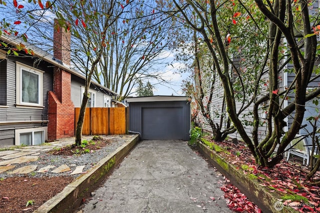4642 Eastern Ave N, Seattle, WA 98103 - view of side of property featuring a chimney, an outdoor structure, and driveway
