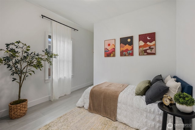 4642 Eastern Ave N, Seattle, WA 98103 - bedroom with light wood-type flooring and baseboards
