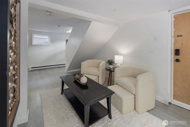 4642 Eastern Ave N, Seattle, WA 98103 - living area featuring baseboard heating and wood finished floors