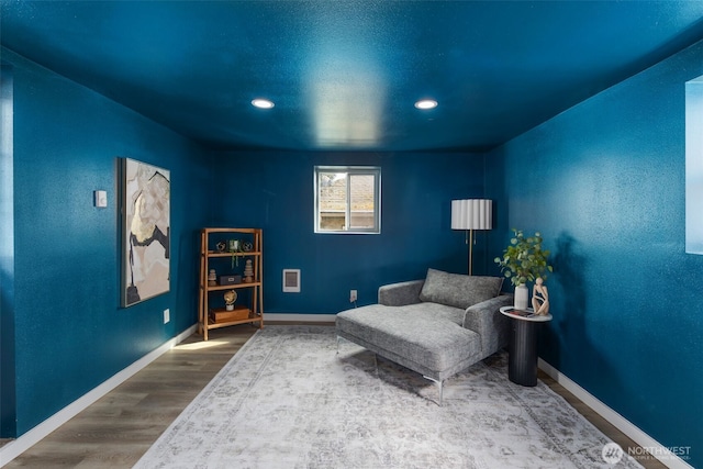 4642 Eastern Ave N, Seattle, WA 98103 - sitting room with wood finished floors and recessed lighting