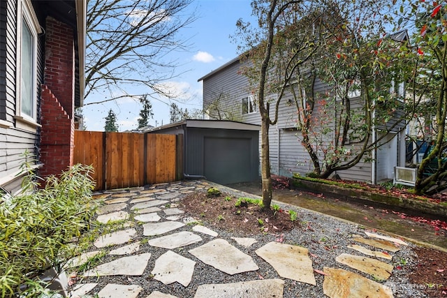 4642 Eastern Ave N, Seattle, WA 98103 - view of patio / terrace with an outbuilding and driveway