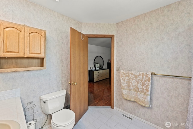 32232 7th Ave SW, Federal Way, WA 98023 - bathroom with toilet, tile patterned floors, and baseboards