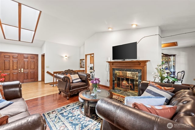 32232 7th Ave SW, Federal Way, WA 98023 - living area featuring vaulted ceiling, a high end fireplace, and wood finished floors