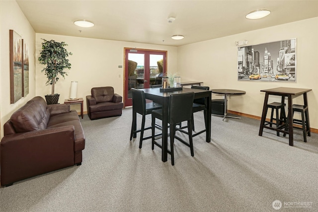 827 Hiawatha Pl S Unit 405, Seattle, WA 98144 - dining space with carpet, baseboards, and french doors