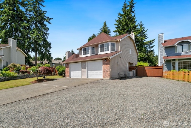 29617 58th Pl S, Auburn, WA 98001 - traditional-style home featuring driveway, an attached garage, brick siding, a chimney, and central AC