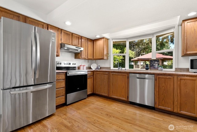 29617 58th Pl S, Auburn, WA 98001 - kitchen featuring appliances with stainless steel finishes, under cabinet range hood, brown cabinetry, light wood-style floors, and recessed lighting