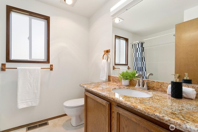 29617 58th Pl S, Auburn, WA 98001 - bathroom with vanity, toilet, curtained shower, and baseboards