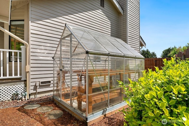 29617 58th Pl S, Auburn, WA 98001 - view of home's exterior featuring a greenhouse, an outdoor structure, and a chimney