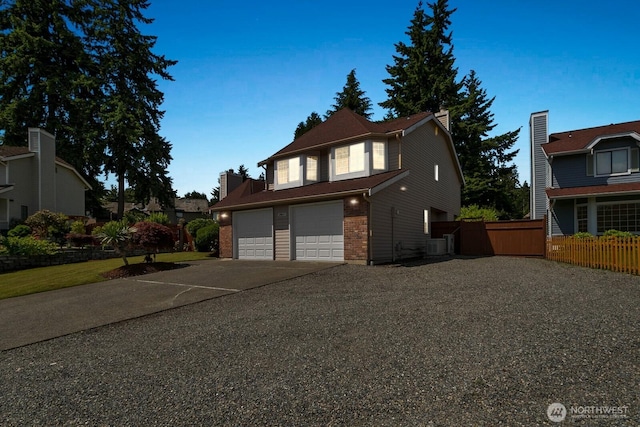 29617 58th Pl S, Auburn, WA 98001 - traditional-style home featuring concrete driveway, brick siding, a garage, cooling unit, and a chimney