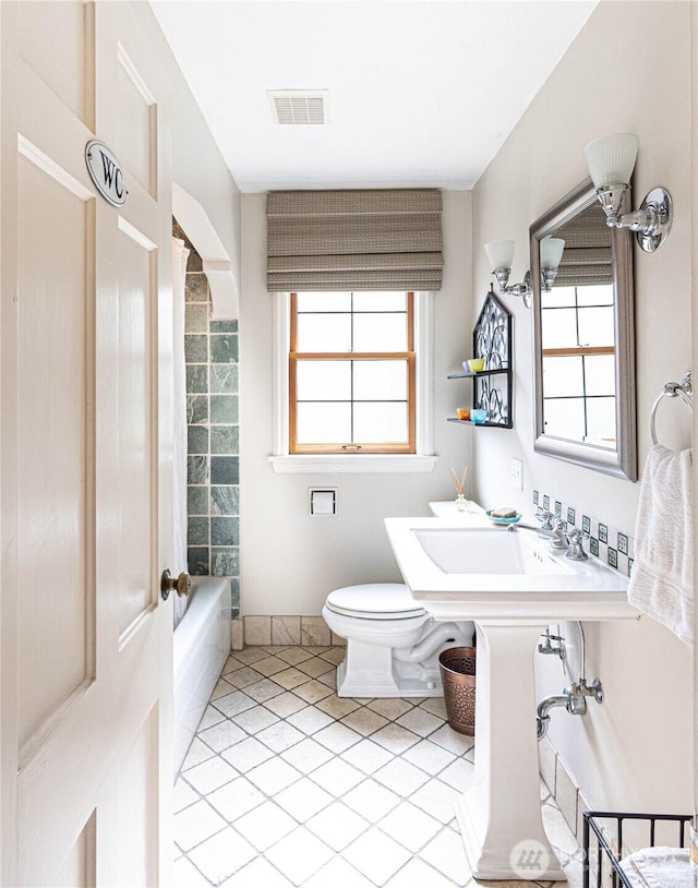 8314 Island Dr S, Seattle, WA 98118 - bathroom with tile patterned flooring and shower / bathtub combination
